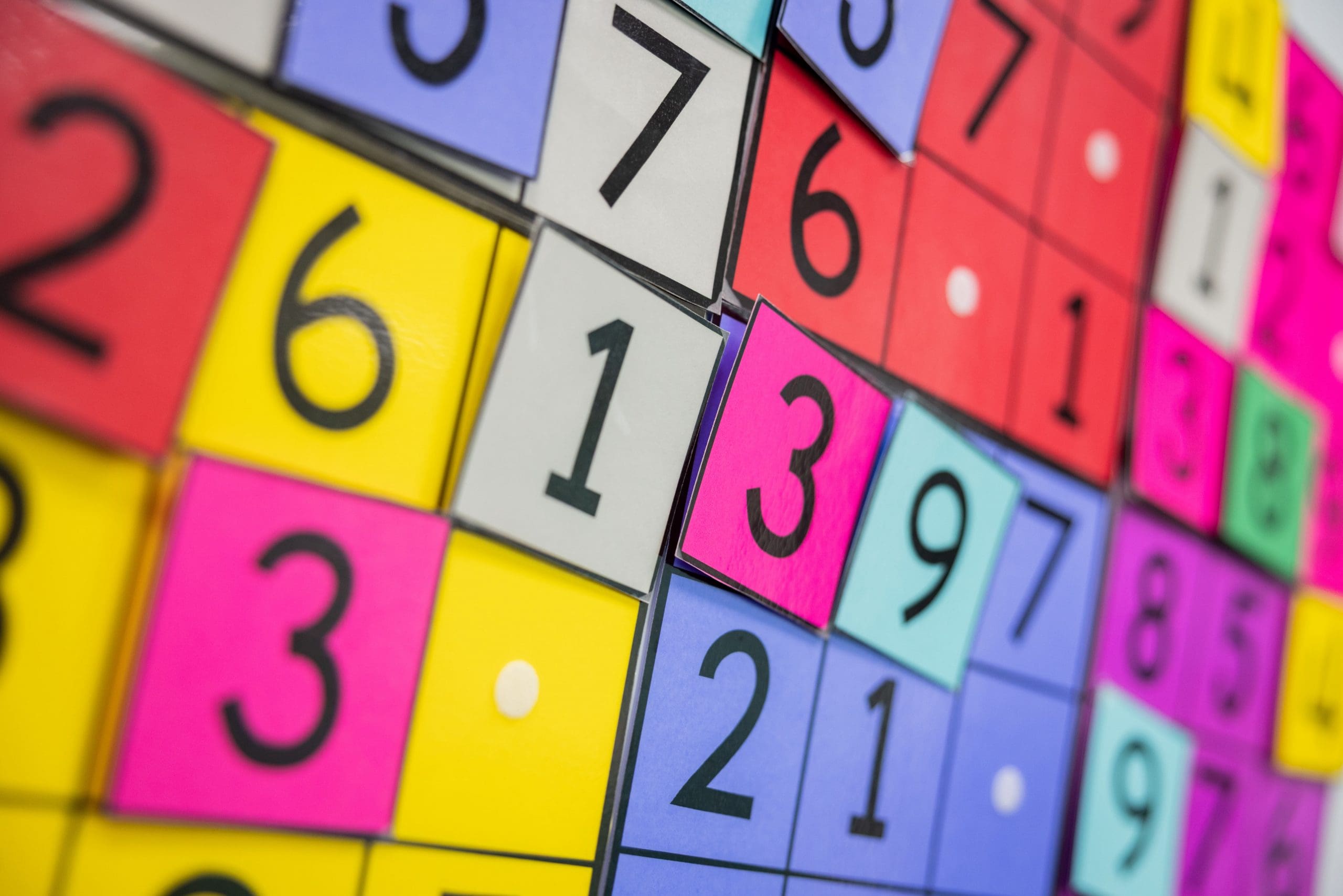 Colorful tiles with large black numbers, arranged in a vibrant, overlapping pattern.